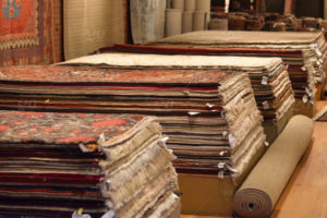 stock-photo-shopping-decor-wool-market-stacked-rugs-silk-37e2dfd7-14c0-47ec-970b-e15b7f7f997d stock-photo-shopping-decor-wool-market-stacked-rugs-silk-37e2dfd7-14c0-47ec-970b-e15b7f7f997d